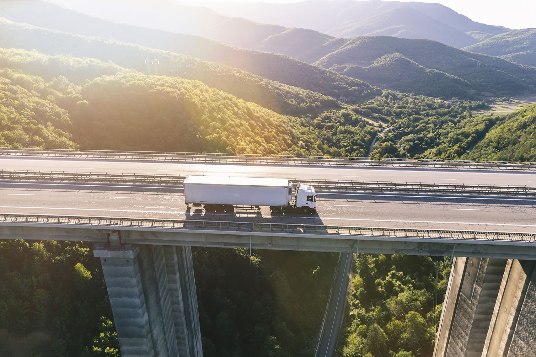 trucks highway mountain sunset.jpg
